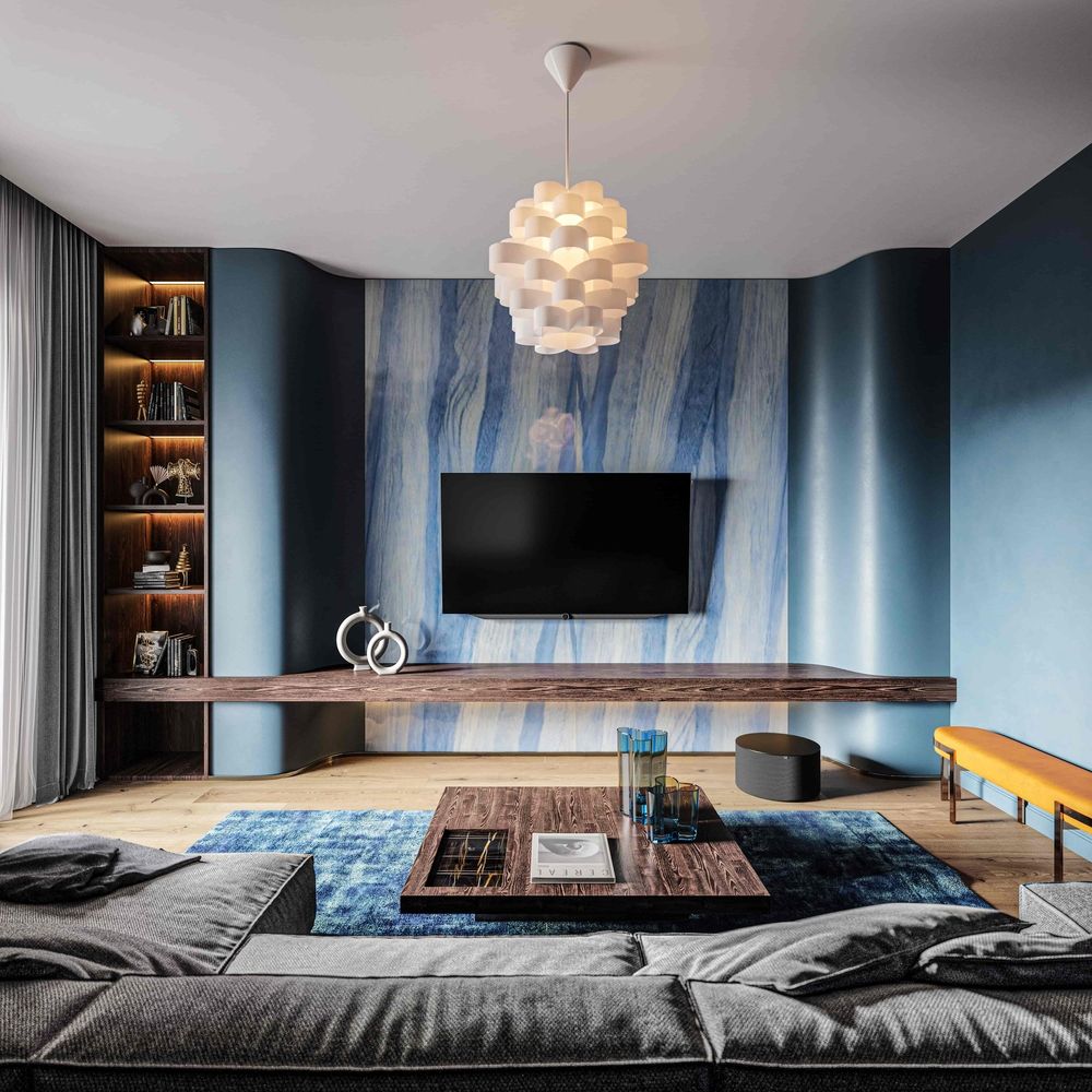 Ein modern eingerichtetes Wohnzimmer mit einem LOEWE. Fernseher